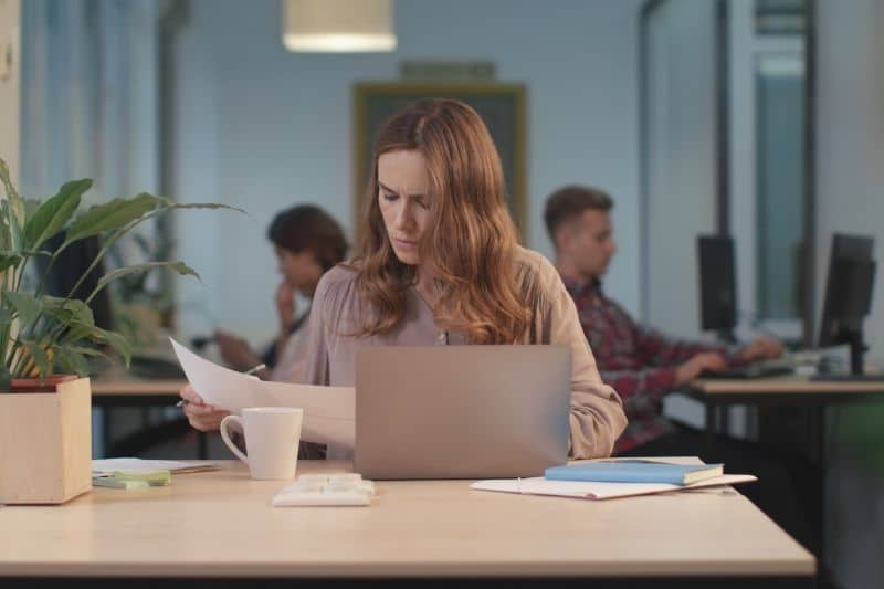 Concentrated woman in office