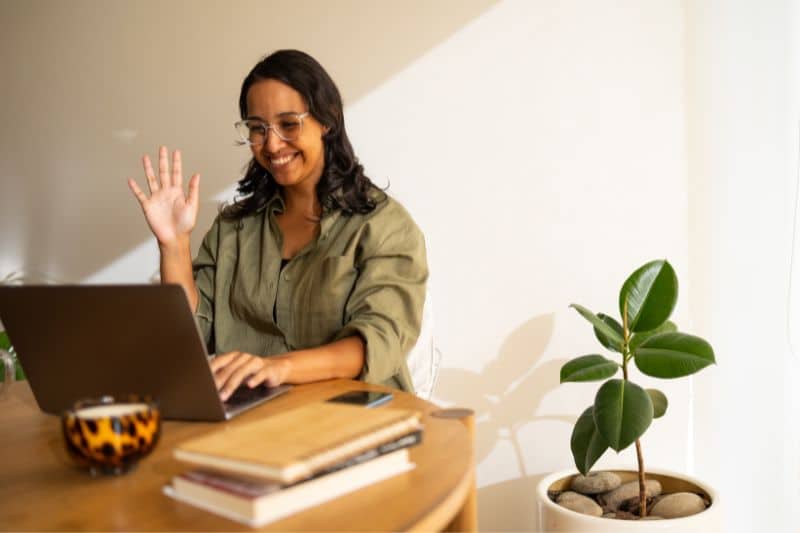 Woman greets in video call